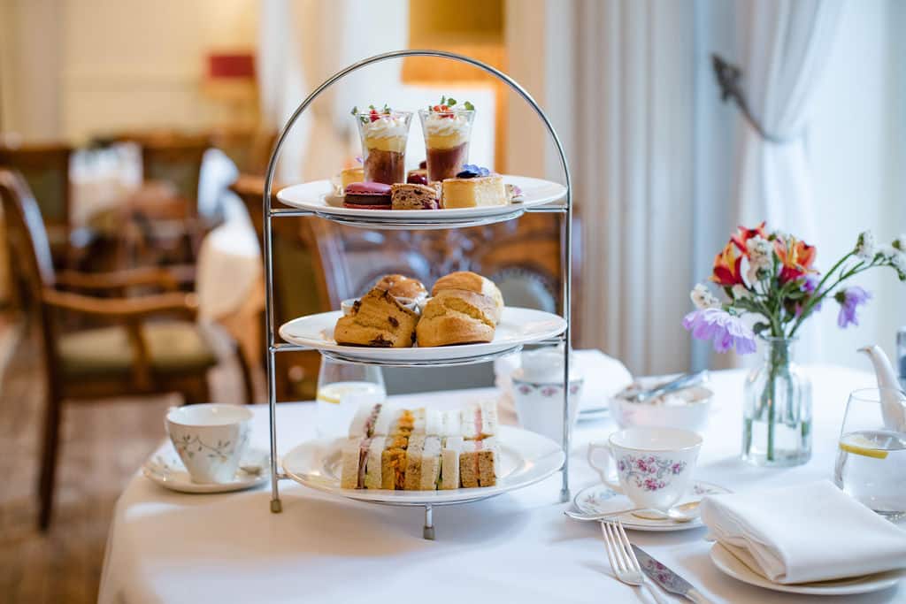 Indulgent Mother's Day afternoon tea with prosecco served in beautifully decorated restaurant at Berwick Lodge in Bristol