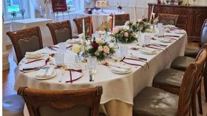 Beautifully decorated round wedding lunch table with elegant candles and floral arrangements in a private dining room at luxury hotel and intimate wedding venue in Bristol, Berwick Lodge.