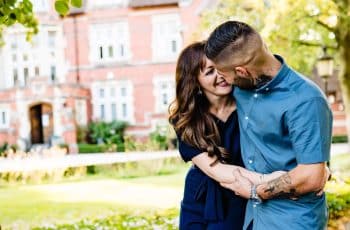 A happy couple lovingly embracing while walking outside Berwick Lodge, enjoying a romantic getaway in Bristol – perfect for a Valentine’s celebration.